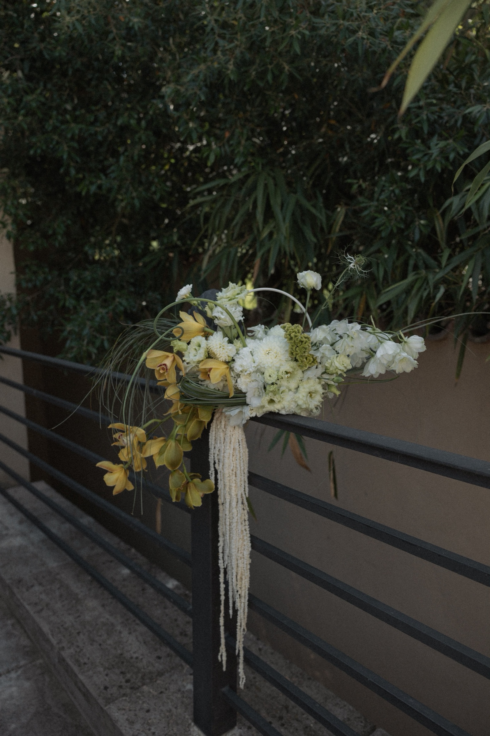 Bouquet resting on a railing at dusk