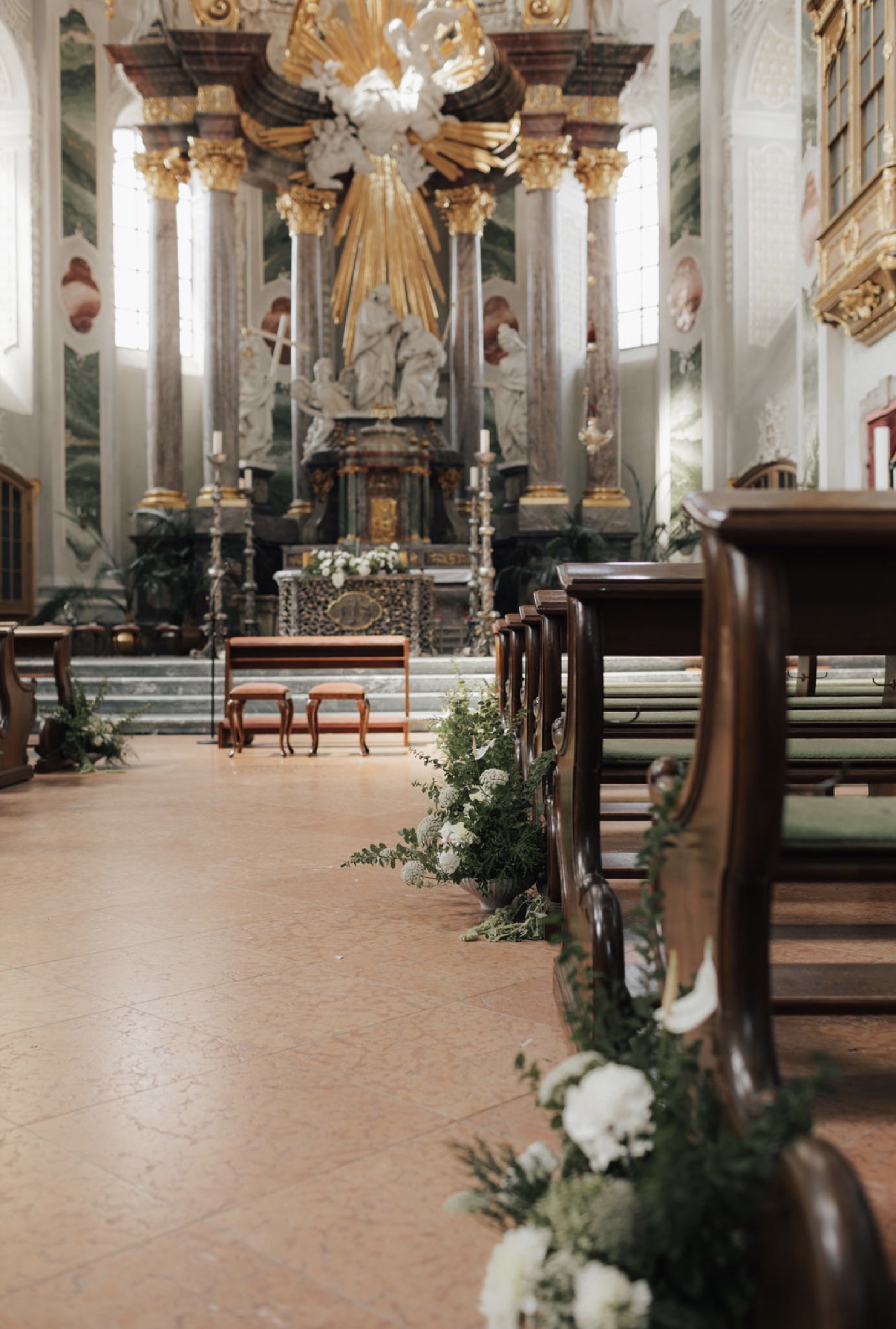 Church aisle dressed in white florals