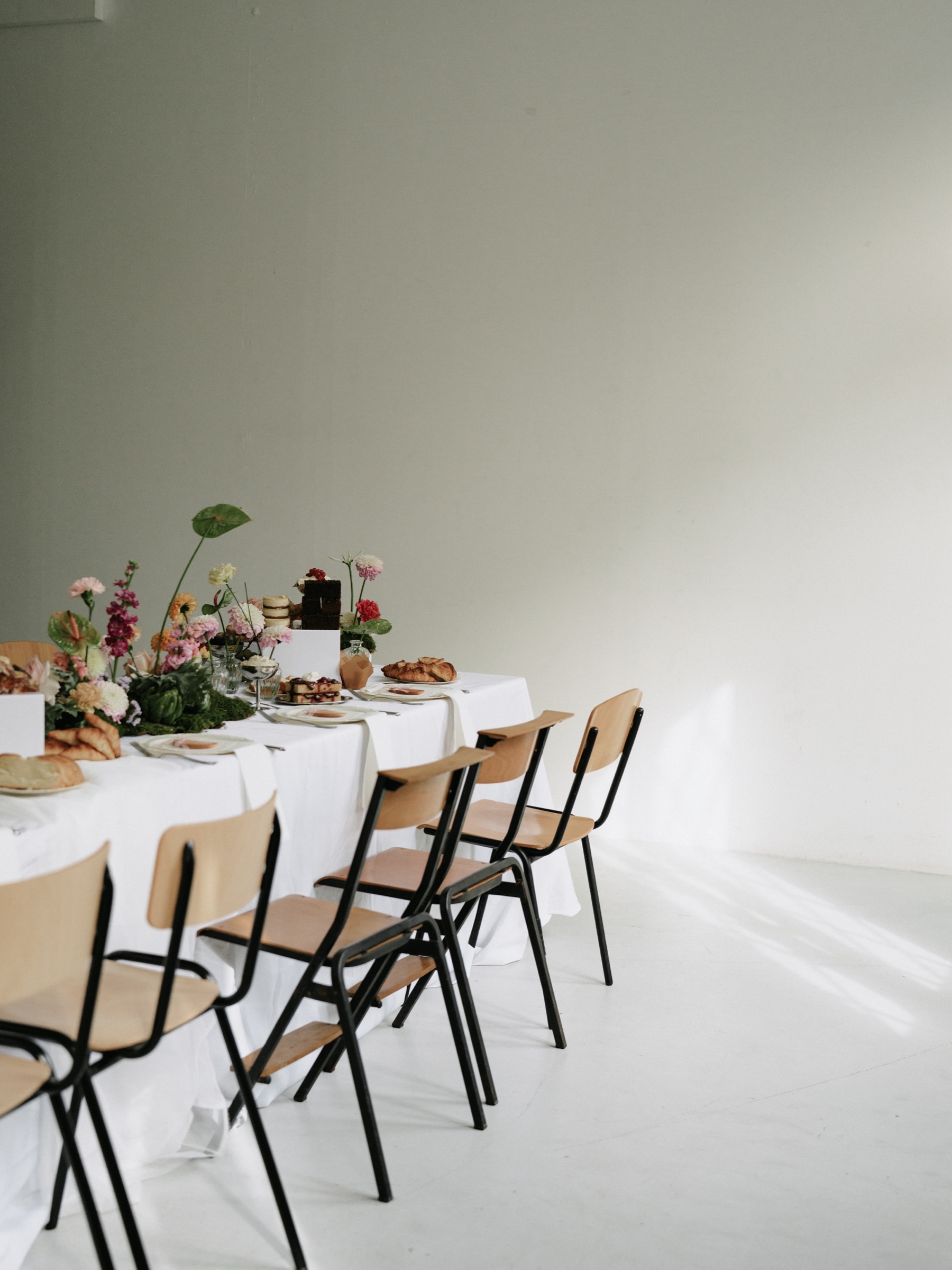 Minimal loft with a long white table