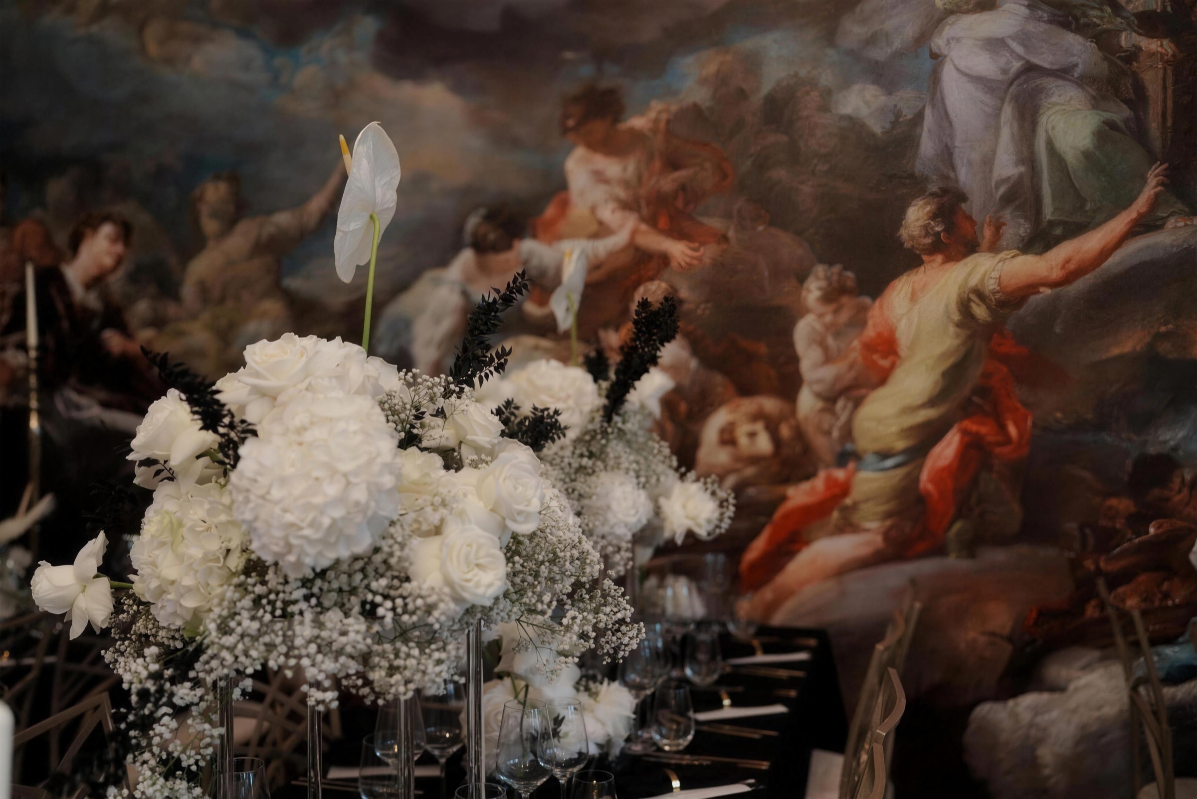 White hydrangea arrangement before a baroque fresco