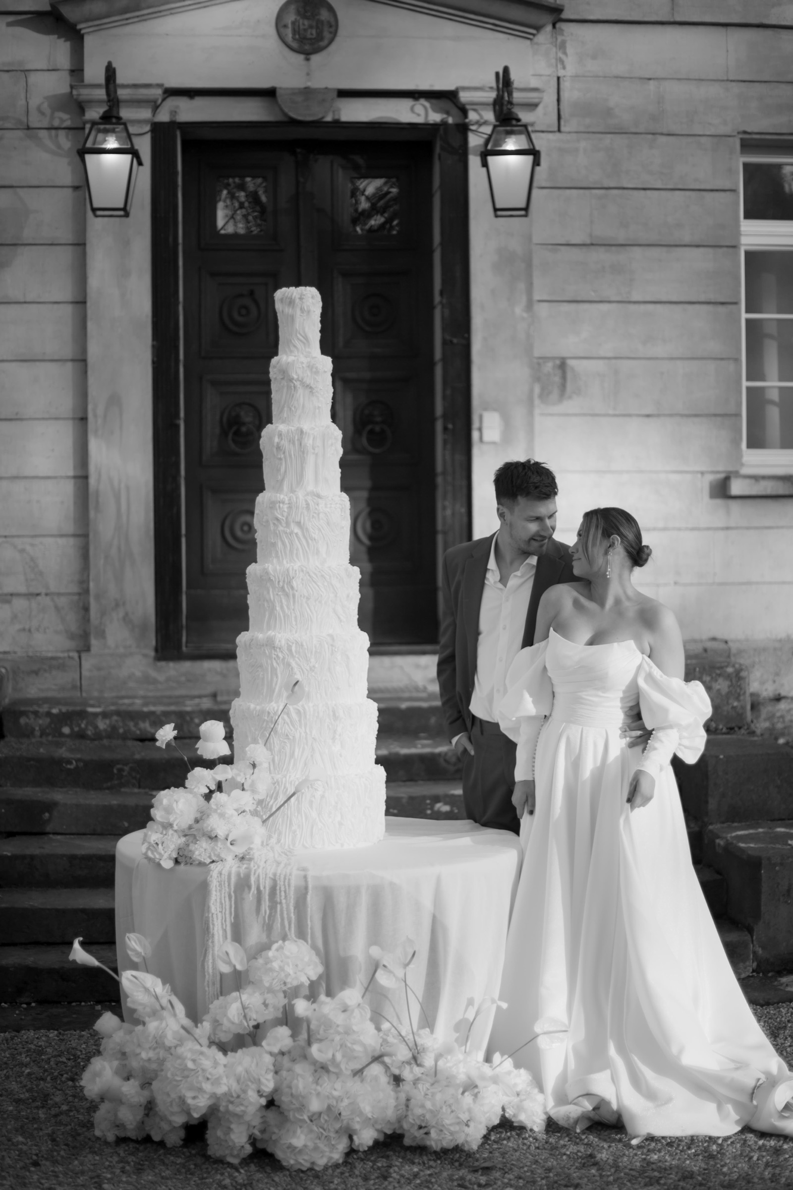 Wedding cake framed by white hydrangea at the manor